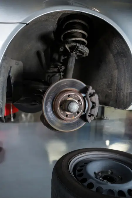 Hands using a wrench during a mechanical repair