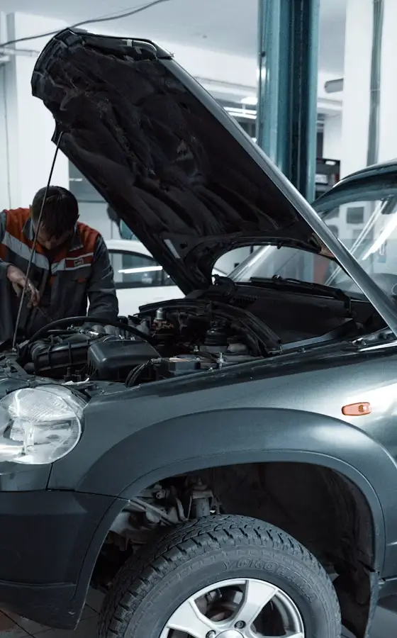 Vehicle being serviced on the workshop hoist